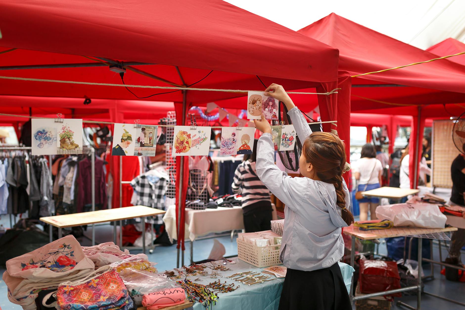 girl arranging displays for sale