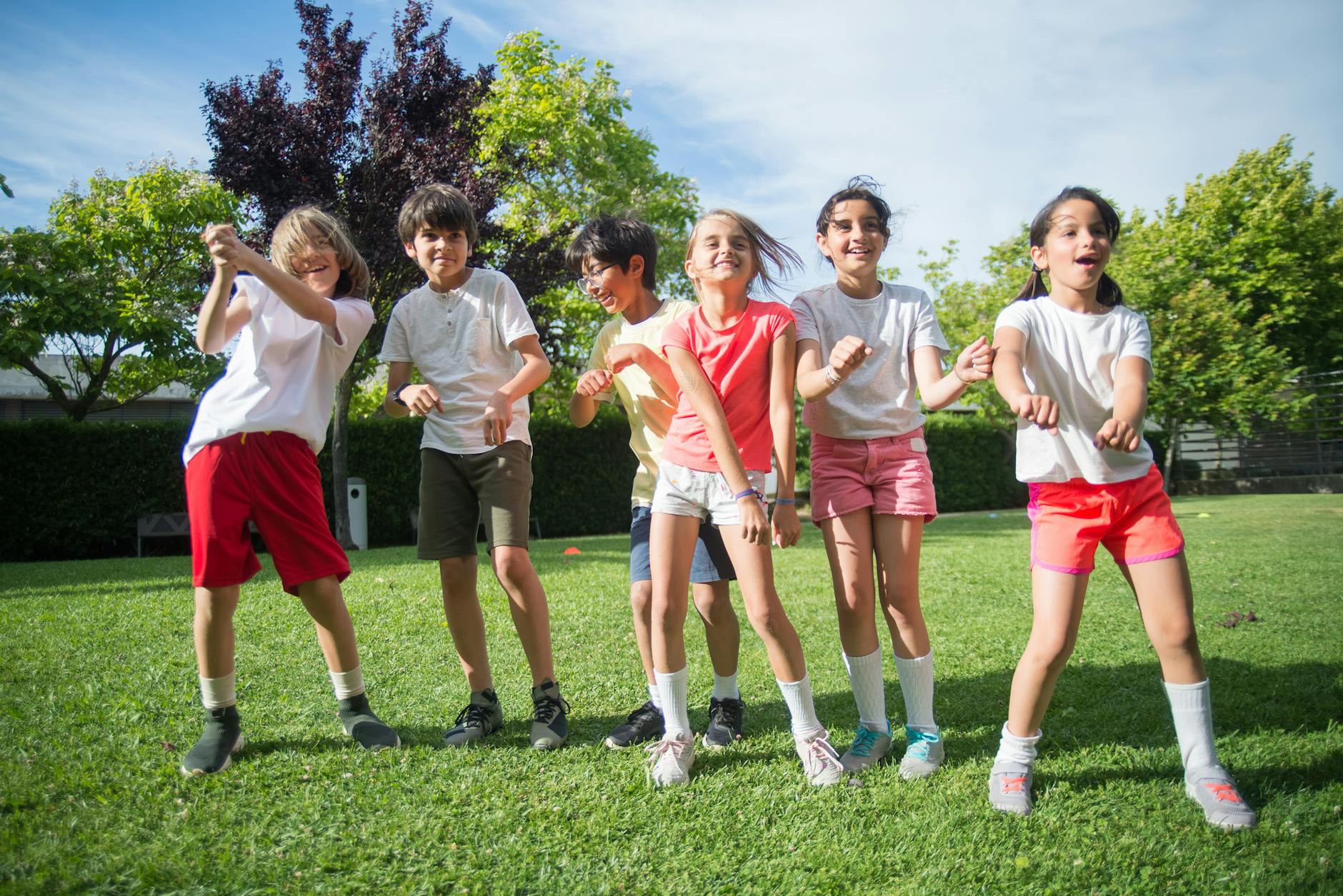 children dancing at a park