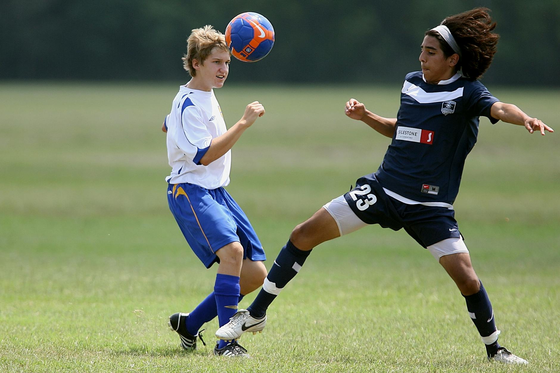 boy playing soccer