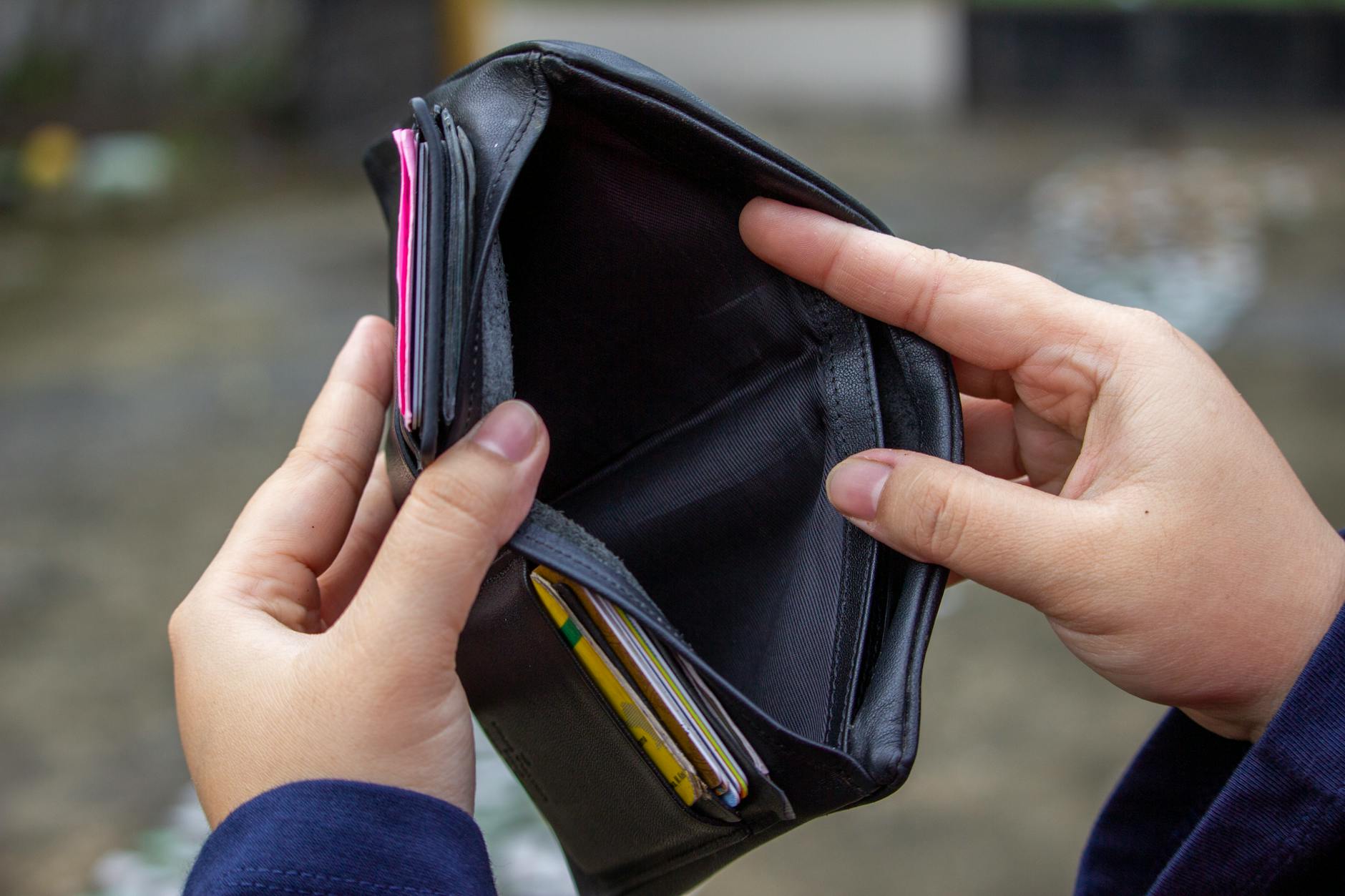 a person looking the wallet